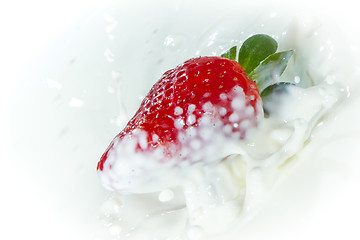 Image showing strawberry splashing into milk