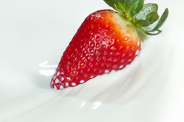 Image showing strawberry splashing into milk