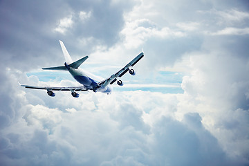 Image showing Airliner flying through the thick clouds