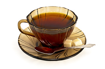 Image showing Tea in a cup with a spoon of brown sugar and