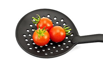 Image showing Tomatoes on the black skimmer