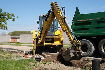 Image showing excavator loaded dumper truck