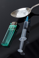 Image showing Syringe, spoon, heroin and lighter