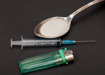 Image showing Syringe, spoon, heroin and lighter