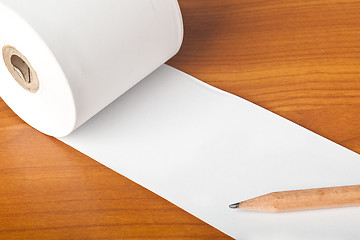 Image showing Roll of paper and pencil