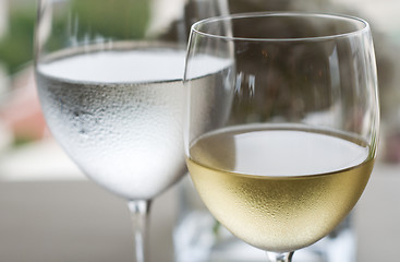 Image showing White wine and water