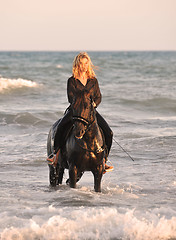 Image showing riding woman in sea
