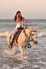 Image showing woman and  horse in the sea