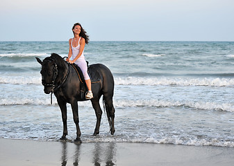 Image showing riding girl on a beach