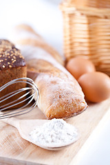 Image showing bread, flour, eggs and kitchen utensil