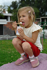 Image showing the girl eats ice-cream