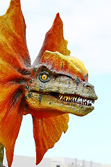 Image showing Dilophosaurus dinosaur with orange collar