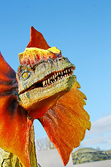 Image showing Dilophosaurus dinosaur with orange collar