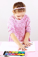 Image showing Cute girl painting with watercolor