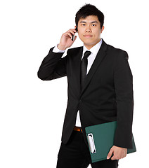 Image showing young business man with mobile phone