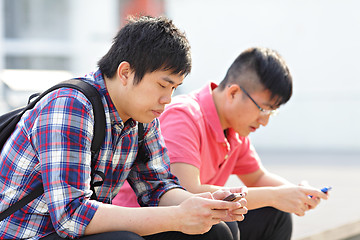 Image showing young man looking on cellphone