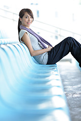 Image showing sporty girl sit in sport arena