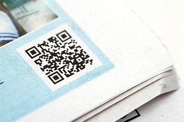 Image showing qr code on news paper
