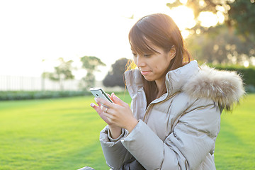 Image showing young woman with mobile phone