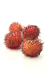 Image showing four fresh rambutan