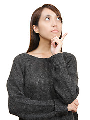 Image showing thoughtful woman looking up