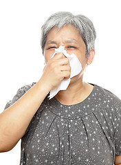 Image showing sneezing mature woman