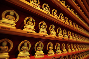 Image showing rows of golden buddha statue