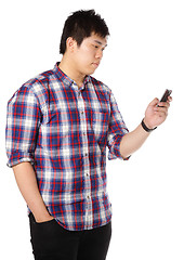 Image showing man sms on mobile phone