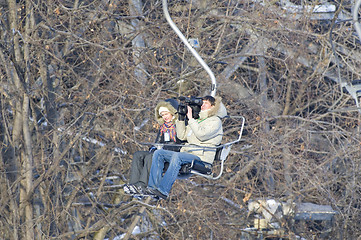 Image showing director with assistant in ski-lift support