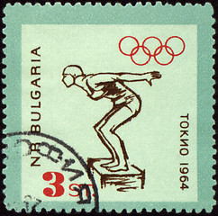 Image showing Jumping swimmer on post stamp