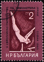 Image showing Female gymnast on post stamp