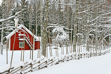 Image showing Little red house covered by snow