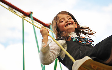 Image showing swinging girl