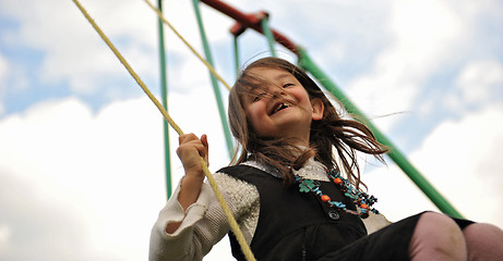 Image showing swinging girl