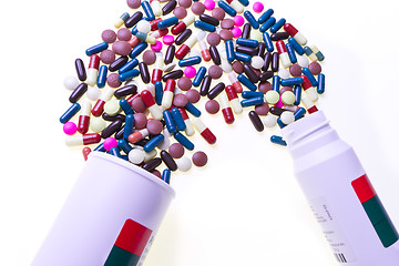 Image showing pills spilling out of container 