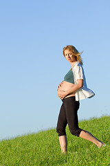 Image showing pregnant woman on meadow