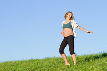 Image showing pregnant woman on meadow