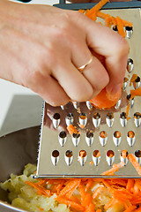 Image showing chef grating carrot