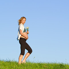 Image showing pregnant woman on meadow