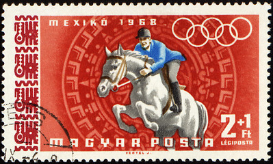 Image showing Jockey riding horse on post stamp