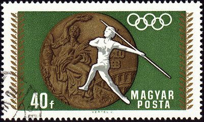 Image showing Javelin throwin and Olympic medal on post stamp