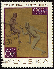 Image showing Two fighting fencers on post stamp