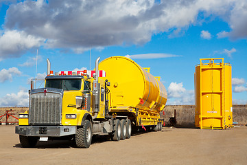 Image showing Yellow Transport With Oilfield Tanks