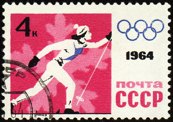 Image showing Running skier on post stamp