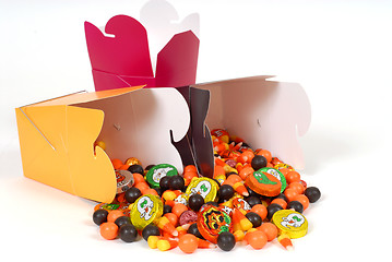 Image showing Halloween candy flowing out of chinese food containers