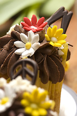 Image showing Spring muffins decorated with flower petals with tulips 