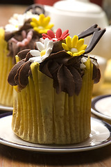 Image showing Spring muffins decorated with flower petals with tulips 