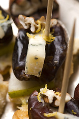 Image showing Appetizer Plate with Dactyl, Pecan nuts and Cheese