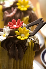 Image showing Spring muffins decorated with flower petals with tulips 