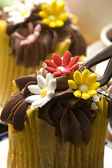 Image showing Spring muffins decorated with flower petals with tulips 